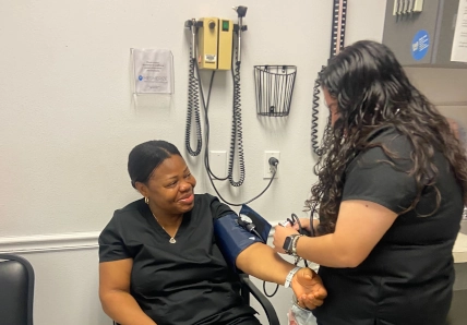 Medical assistant student learning clinical skills